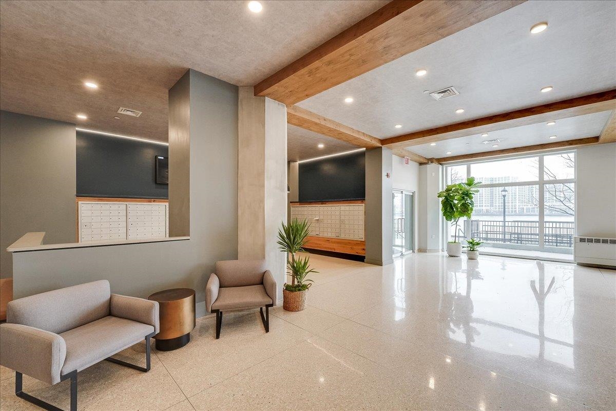 1500 Washington Street, Unit 8K Hoboken, NJ 07030 - Photo 25 of 43 a living room with furniture and a flat screen tv