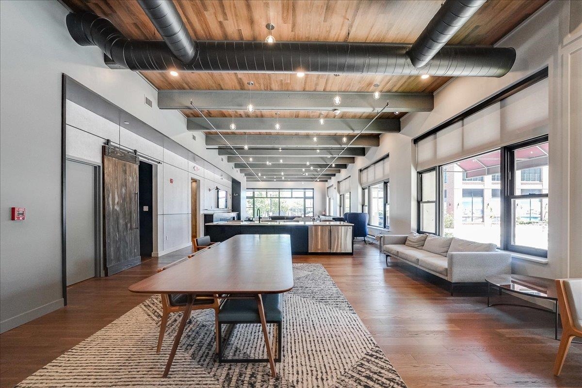 1500 Washington Street, Unit 8K Hoboken, NJ 07030 - Photo 37 of 43 a dining room with furniture a chandelier and wooden floor