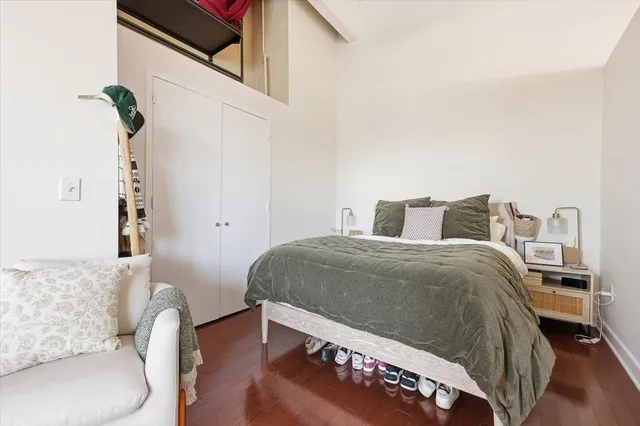 a bedroom with a bed and a couch