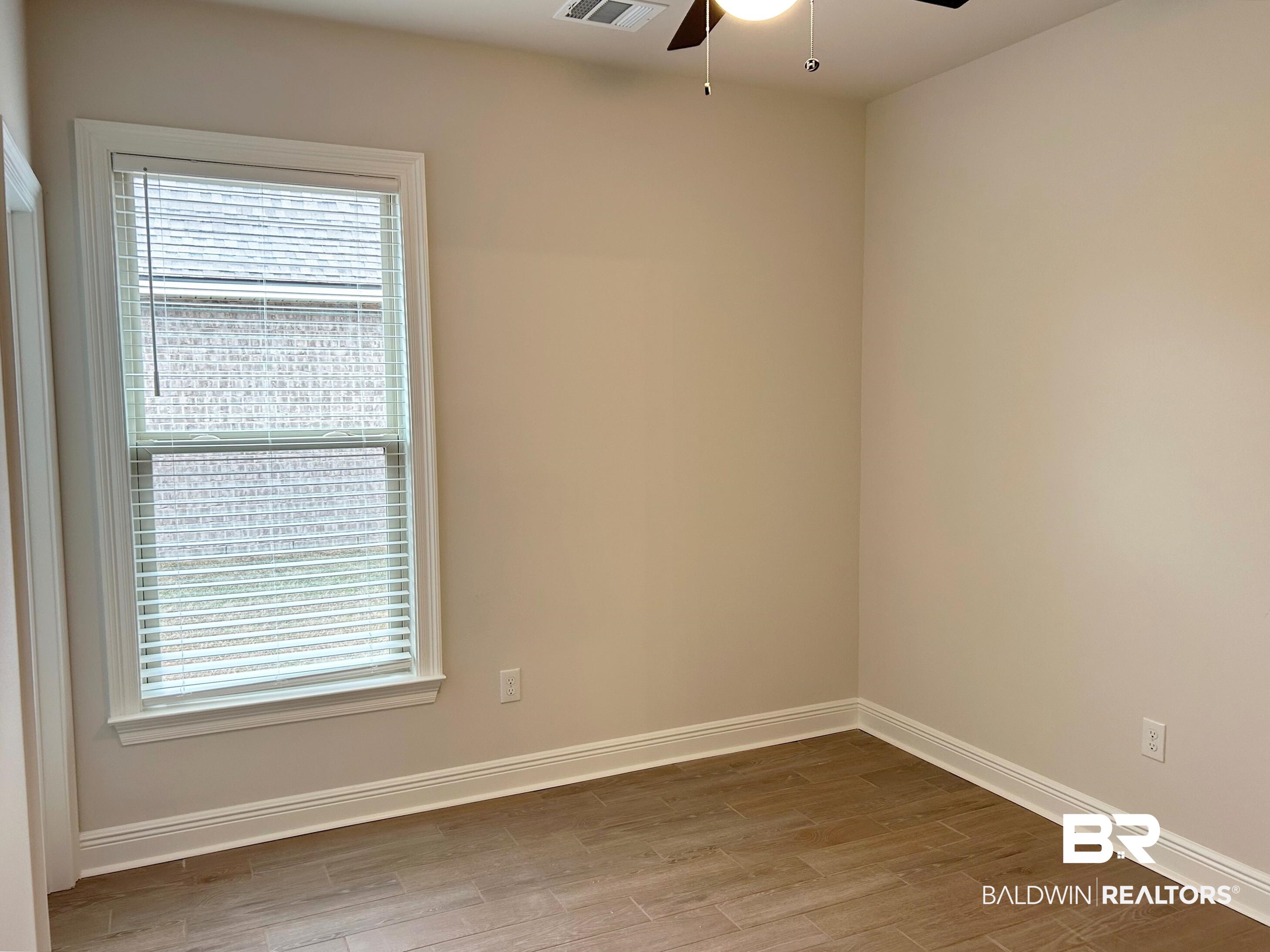 873 Sumter Loop Foley, AL 36535 - Photo 11 of 26 Unfurnished room with a ceiling fan and light wood-type flooring