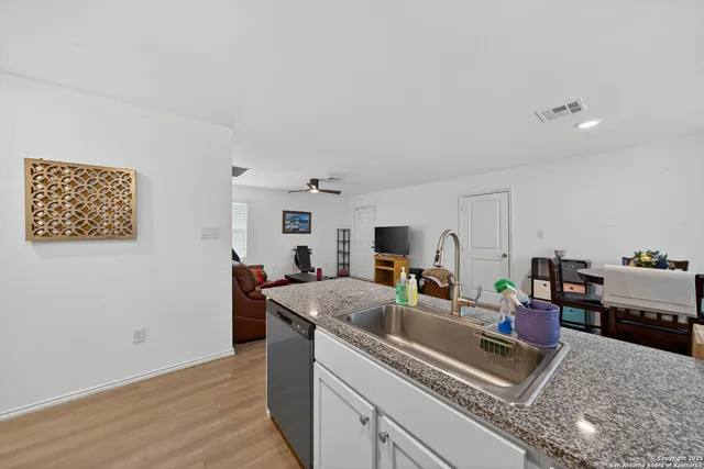 a spacious bedroom with a bed and a window