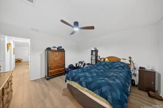 a spacious bathroom with a granite countertop sink mirror and toilet