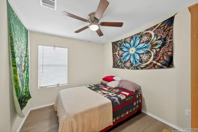a bathroom with a granite countertop sink toilet mirror and shower