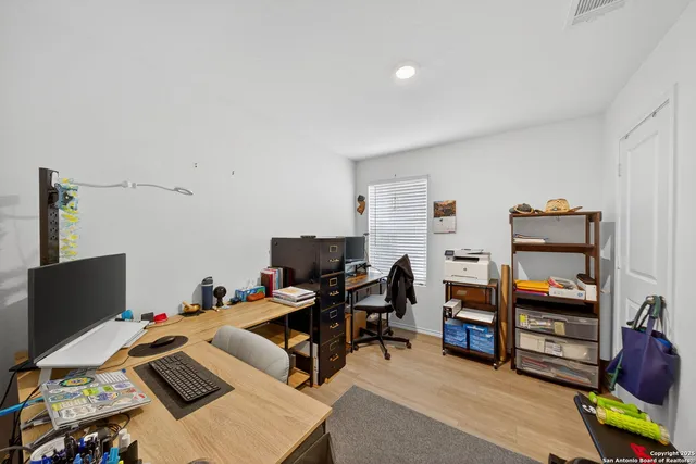 a backyard of a house with wooden fence