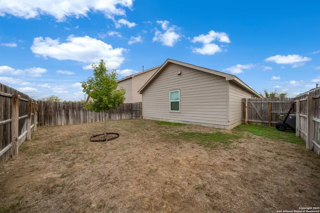 a house view with a backyard space