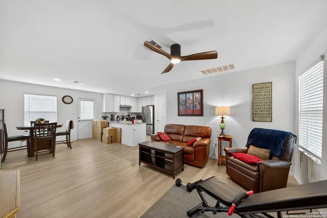 a view of a livingroom with furniture and a flat screen tv