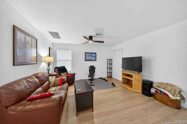 a view of a livingroom with furniture and wooden floor