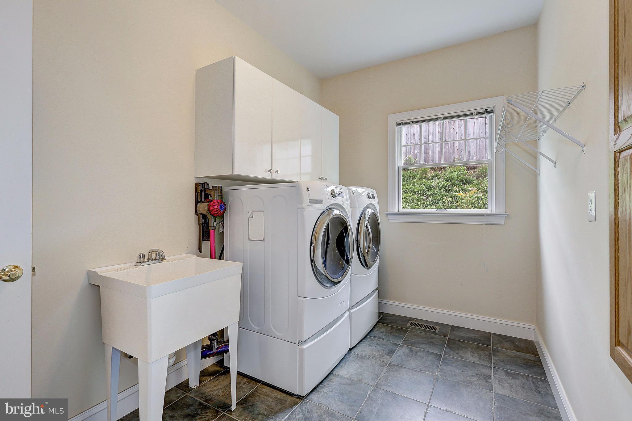 390 Ridgely Avenue Annapolis, MD 21401 - Photo 24 of 32 Main Level Laundry w/ Utility Sink and Wall Iron