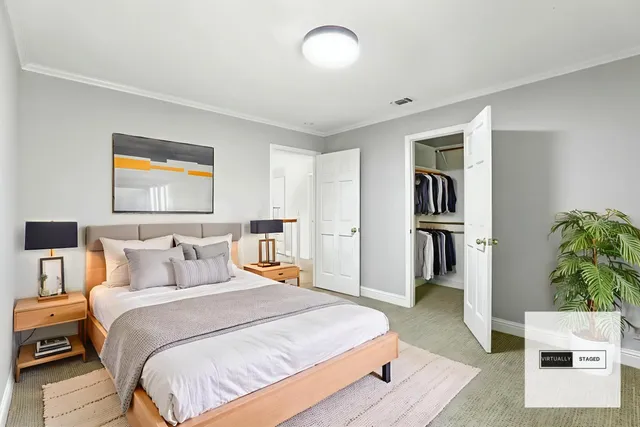 a bedroom with a bed and a book shelf