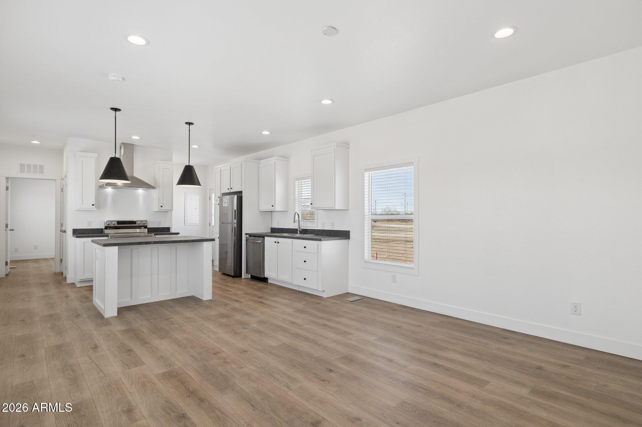 50044 West Century Road Maricopa, AZ 85139 - Photo 2 of 38 a view of kitchen with white cabinets