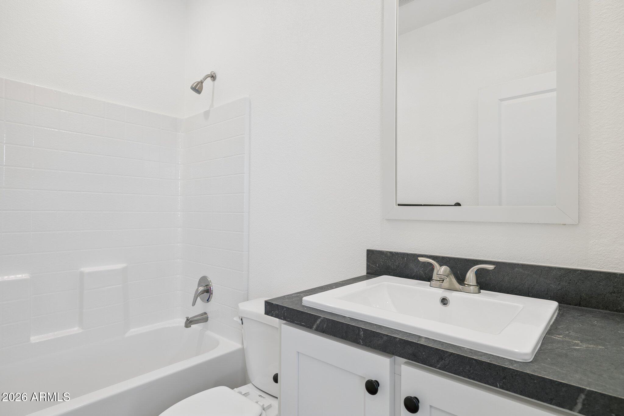 50044 West Century Road Maricopa, AZ 85139 - Photo 28 of 38 a bathroom with a sink and a bathtub