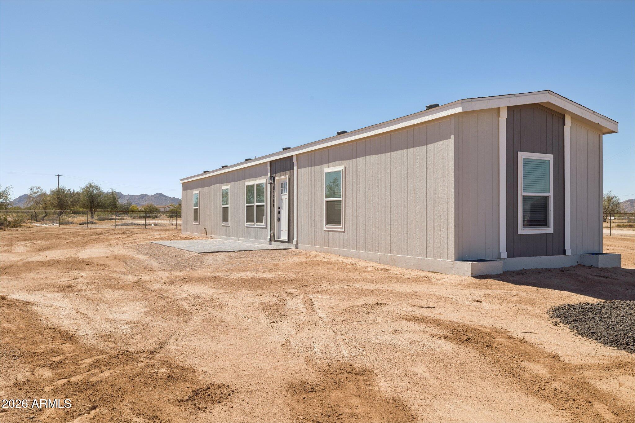 50044 West Century Road Maricopa, AZ 85139 - Photo 8 of 38 a view of a house with a backyard
