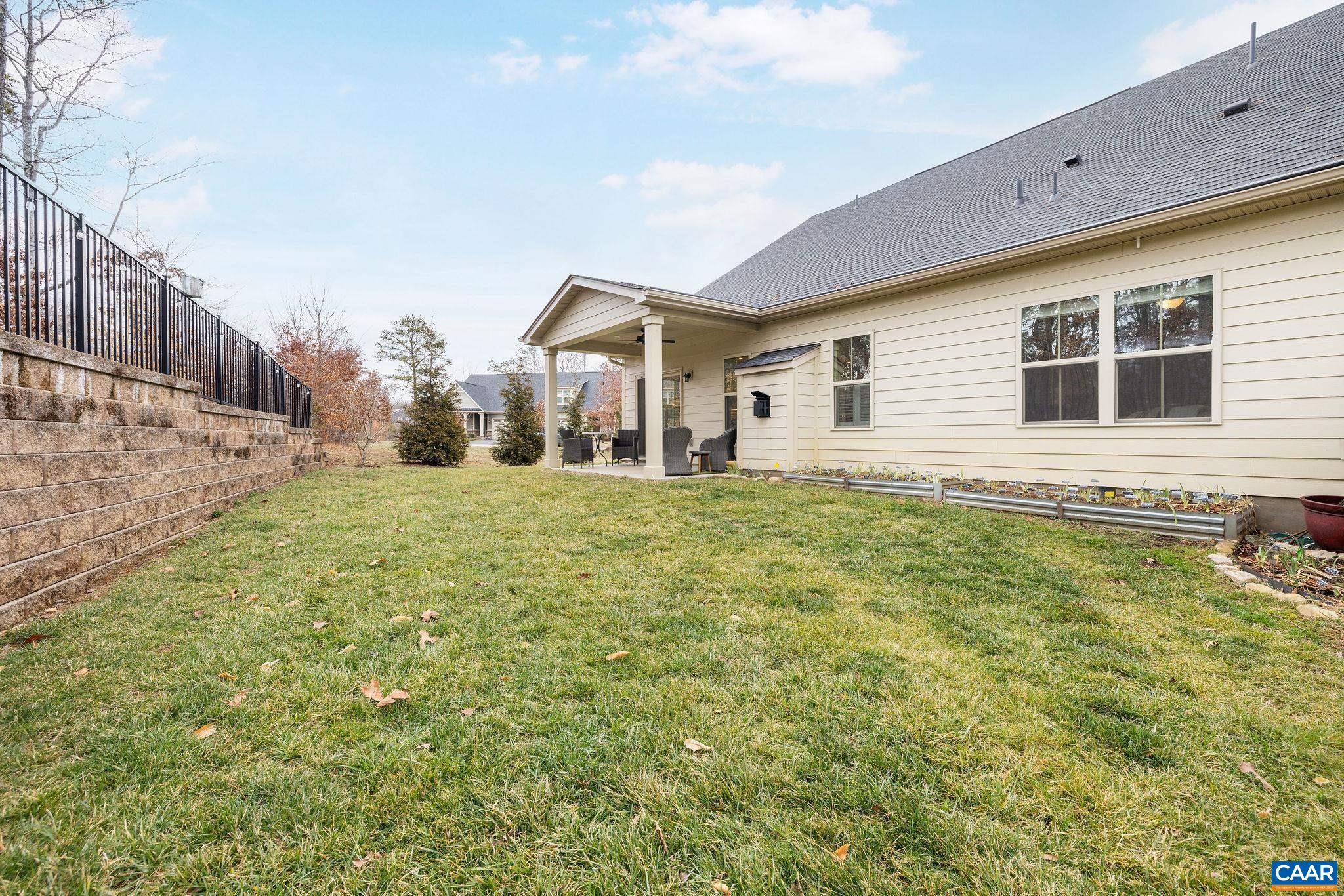 360 Winding Road Keswick, VA 22947 - Photo 45 of 48 a front view of a house with a yard