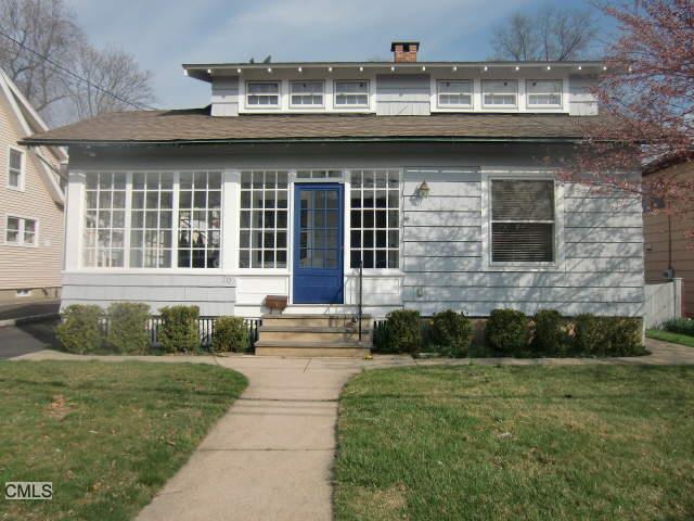 20 Myrtle Street Norwalk, CT 06855 - Photo 1 of 1 a front view of a house with a yard