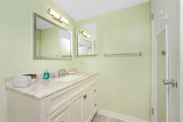 a bathroom with a sink and a mirror