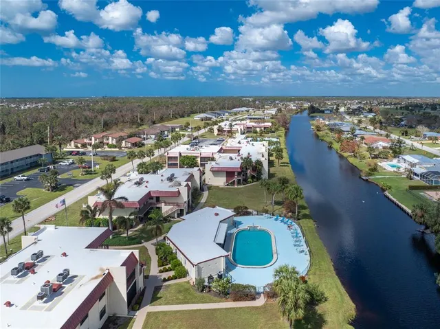 an aerial view of a house with a lake view