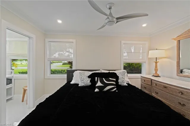 a bedroom with furniture and a window