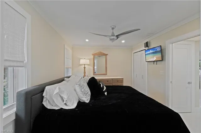a view of entryway with kitchen and wooden floor