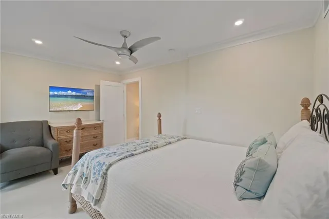 a bedroom with a bed and a couch