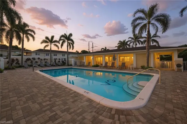 a view of swimming pool with a patio