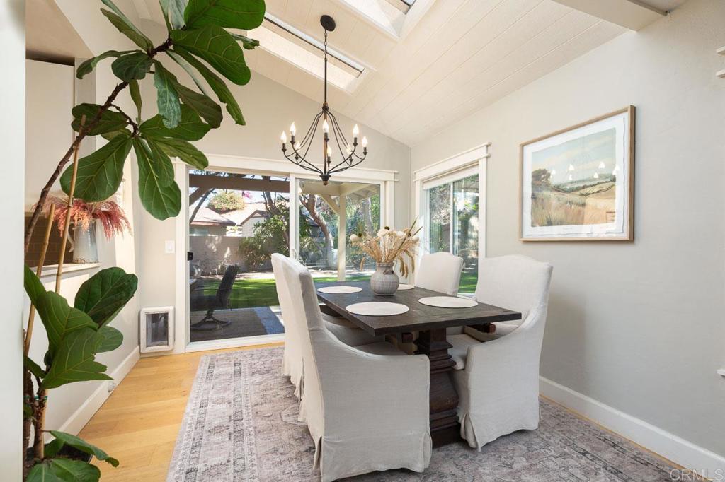 11061 Crystal Springs Road Santee, CA 92071 - Photo 11 of 30 a view of a dining room with furniture wooden floor and chandelier