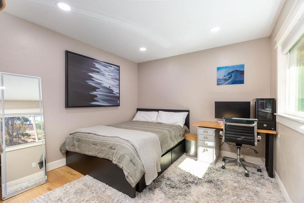11061 Crystal Springs Road Santee, CA 92071 - Photo 18 of 30 a bedroom with a bed and a desk