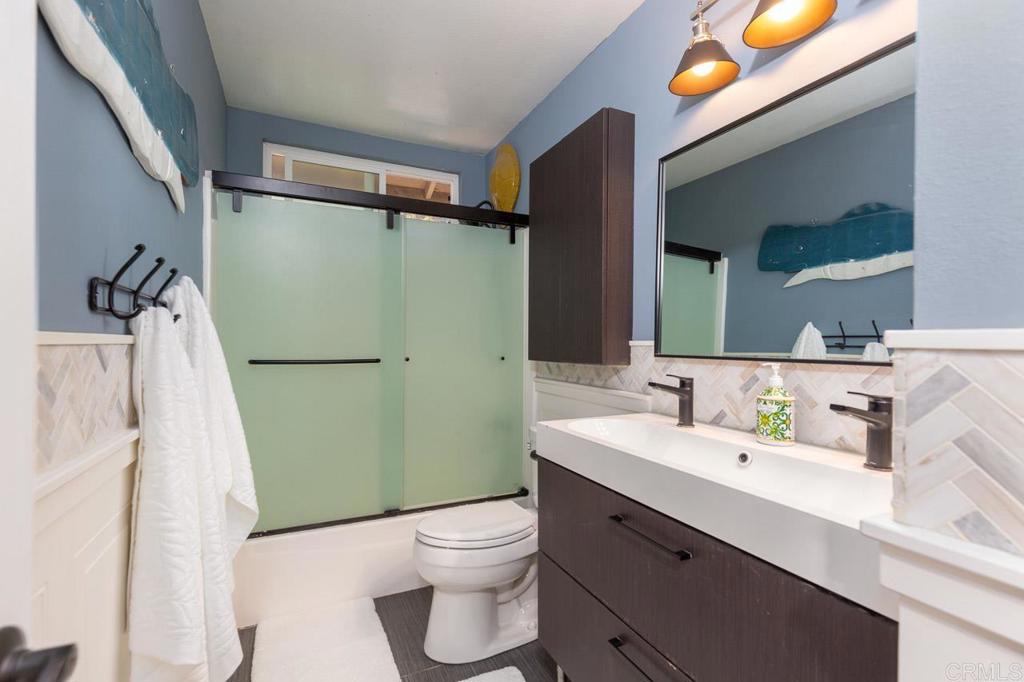 11061 Crystal Springs Road Santee, CA 92071 - Photo 20 of 30 a bathroom with a sink toilet and shower