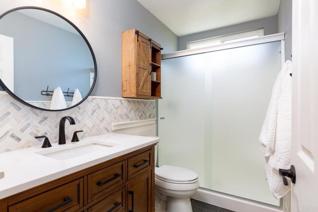 11061 Crystal Springs Road Santee, CA 92071 - Photo 23 of 30 a bathroom with a sink and a mirror