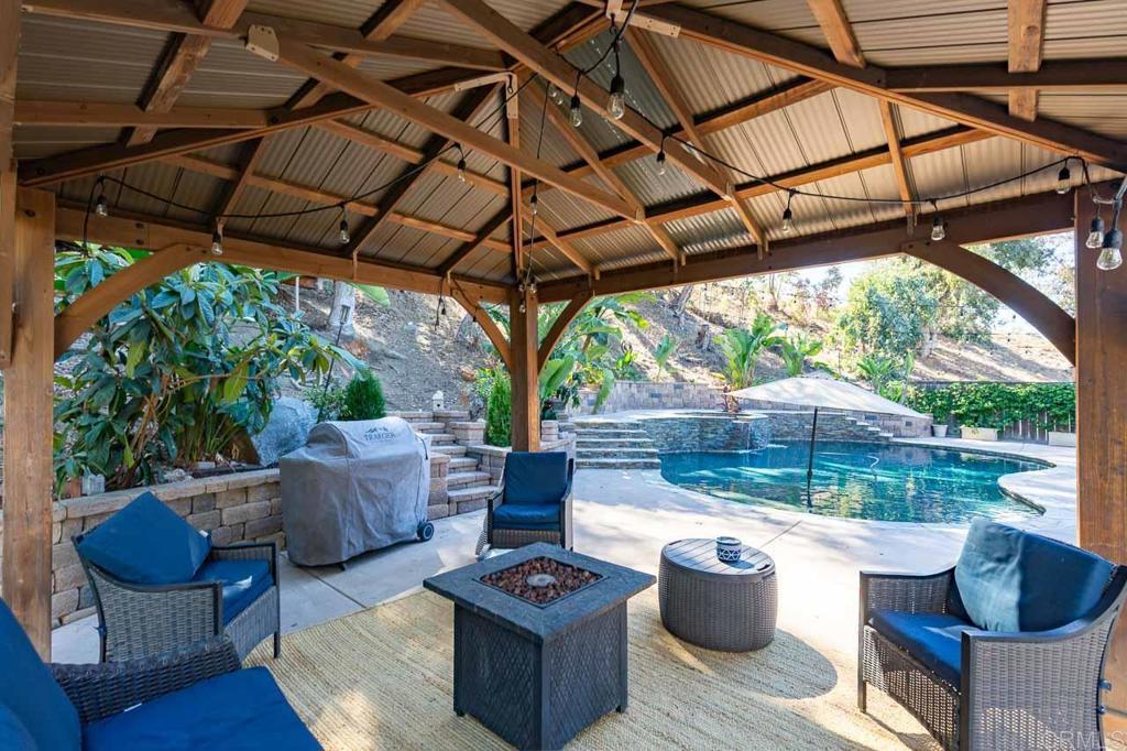 11061 Crystal Springs Road Santee, CA 92071 - Photo 3 of 30 a view of a patio with couches and a potted plant
