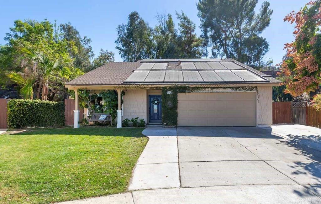 11061 Crystal Springs Road Santee, CA 92071 - Photo 4 of 30 a front view of a house with a garden