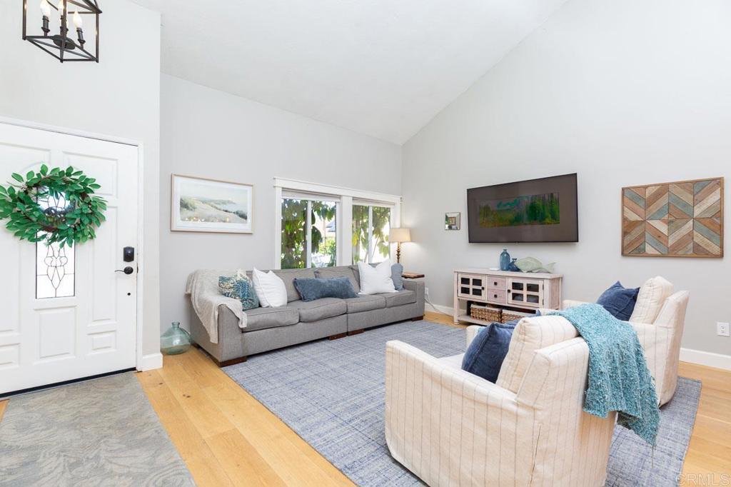 11061 Crystal Springs Road Santee, CA 92071 - Photo 5 of 30 a living room with furniture a flat screen tv and a window