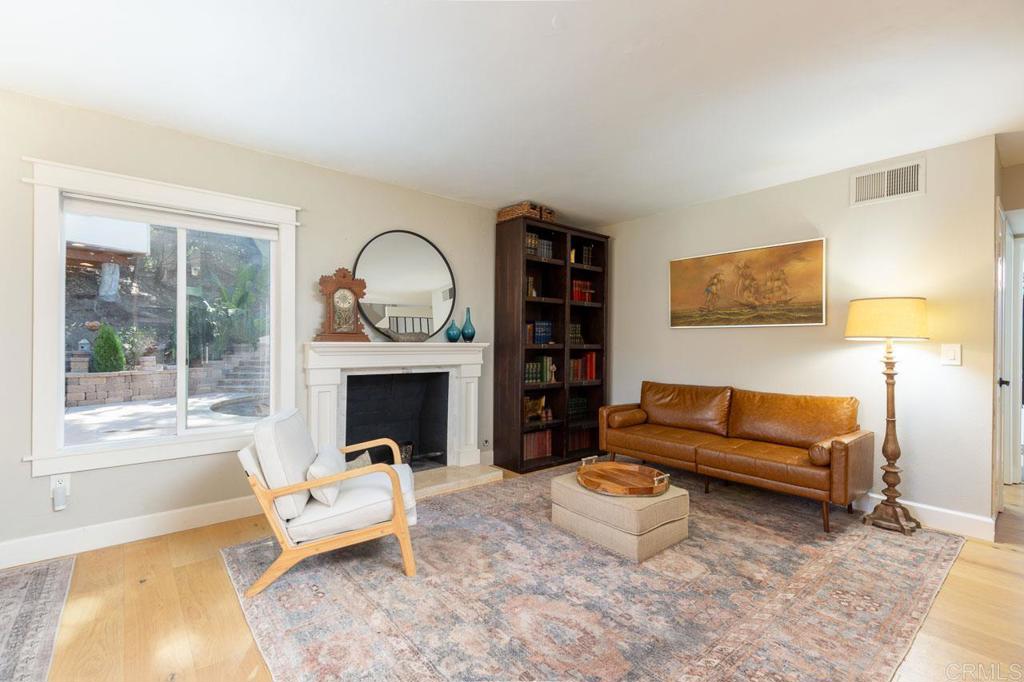11061 Crystal Springs Road Santee, CA 92071 - Photo 8 of 30 a living room with furniture and a fireplace