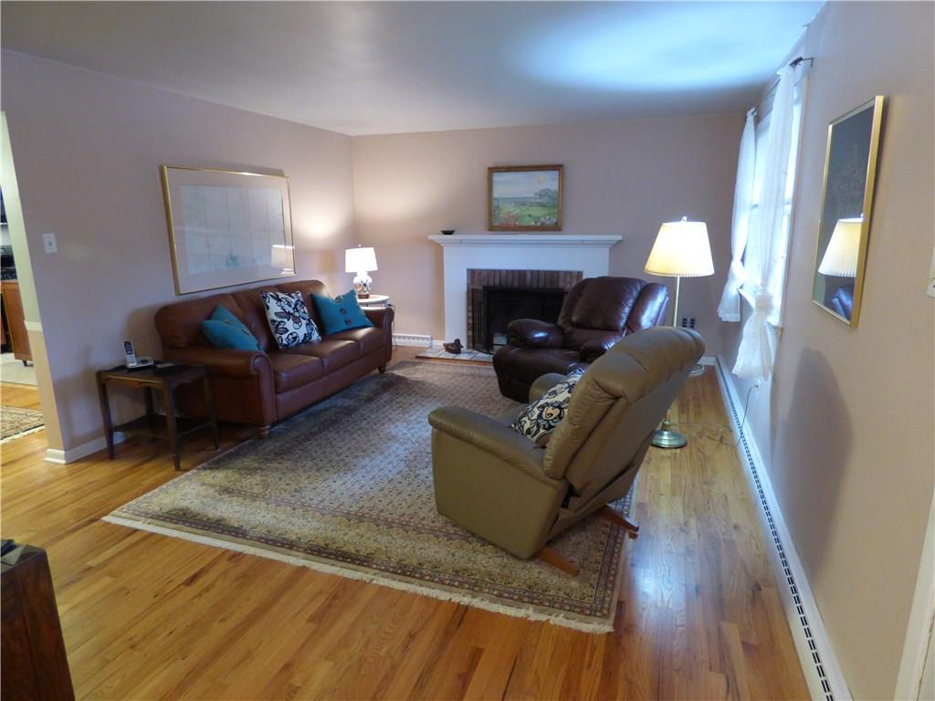 100 Bell Court Road McKees Rocks, PA 15136 - Photo 8 of 23 Beautiful Hardwood Flooring! Log Burning Fireplace in Living Room