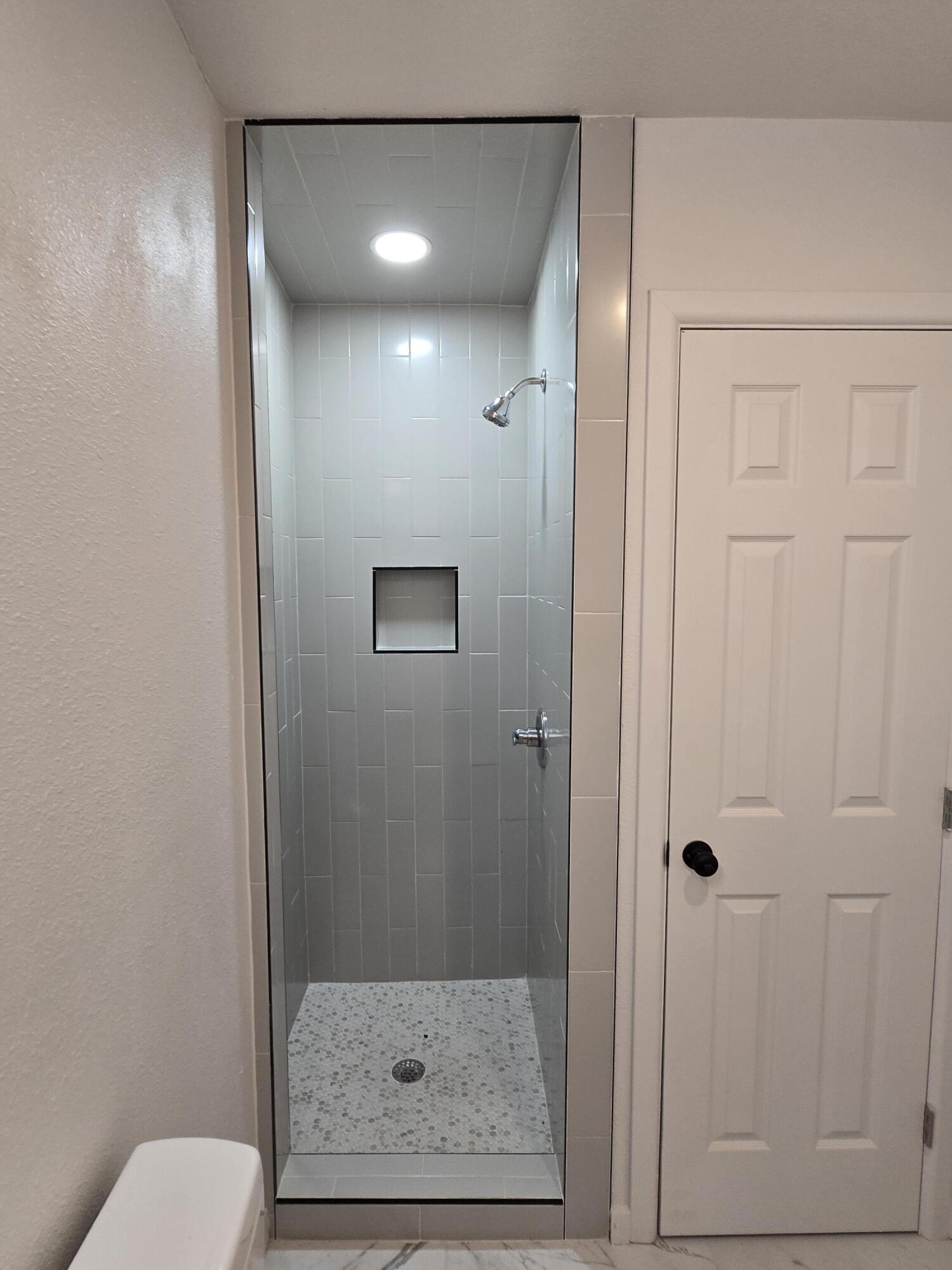 205 North 21st Street Lamesa, TX 79331 - Photo 8 of 14 a bathroom with a shower