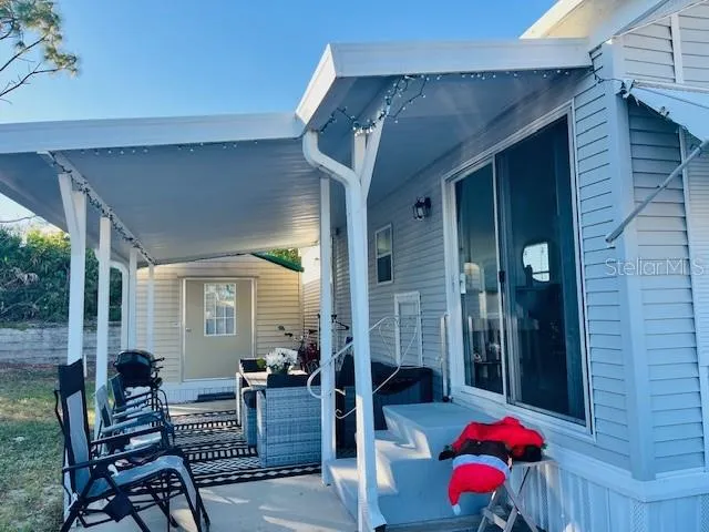 a outdoor space with patio the couches and a potted plant on a table
