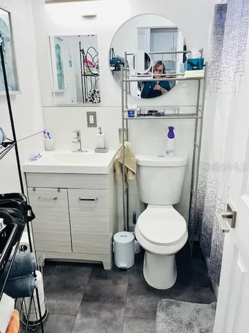 a bathroom with a sink toilet and a shower