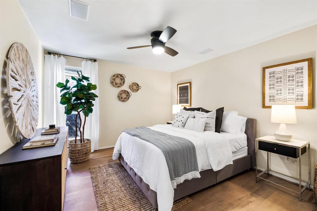 4338 Travis Street Dallas, TX 75205 - Photo 14 of 17 a bedroom with a large bed and a potted plant