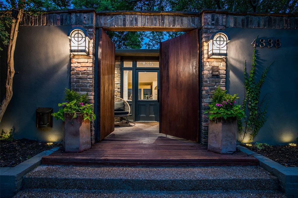 4338 Travis Street Dallas, TX 75205 - Photo 2 of 17 a vase with flowers sitting on a table in front of a house