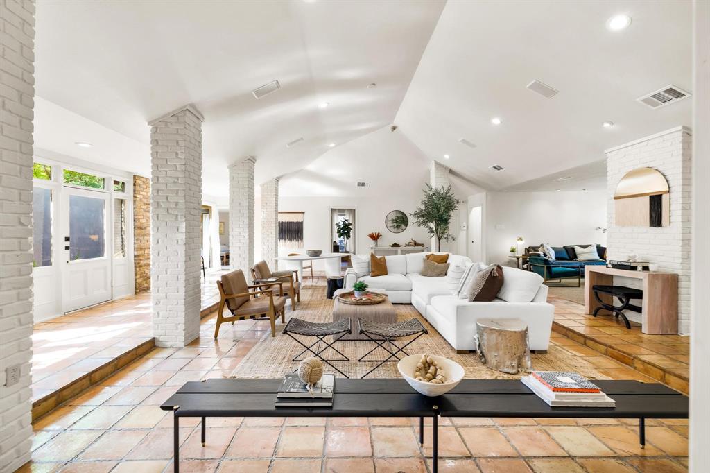 4338 Travis Street Dallas, TX 75205 - Photo 3 of 17 a living room with furniture a rug and a fireplace