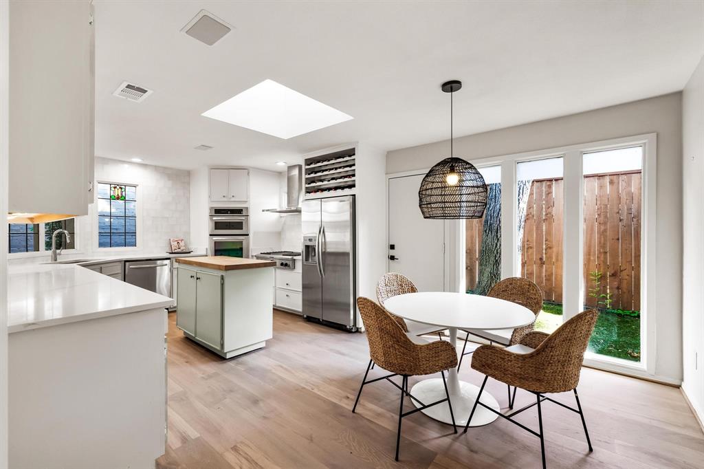 4338 Travis Street Dallas, TX 75205 - Photo 10 of 17 a view of a dining room with furniture window and wooden floor