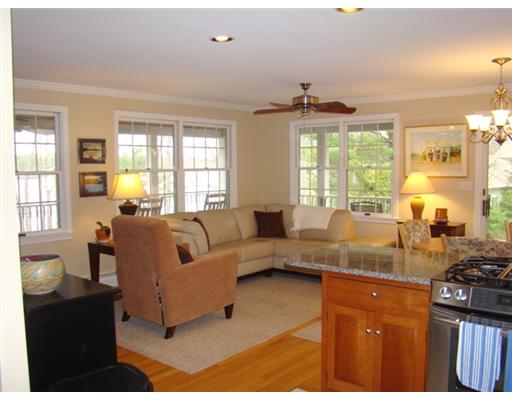 Interior Space/Layout. Spacious, open layout kitchen, dining and living area with many windows and amazing water views.