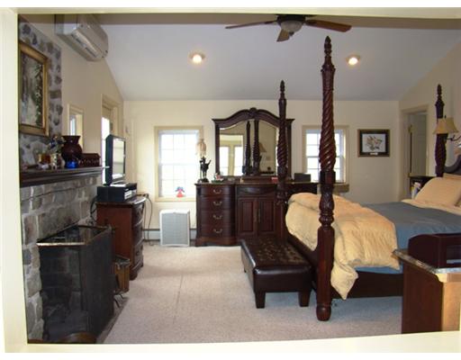Master Bedroom. Large & private master suite with large bath, walk in closet & vintage stone fireplace.