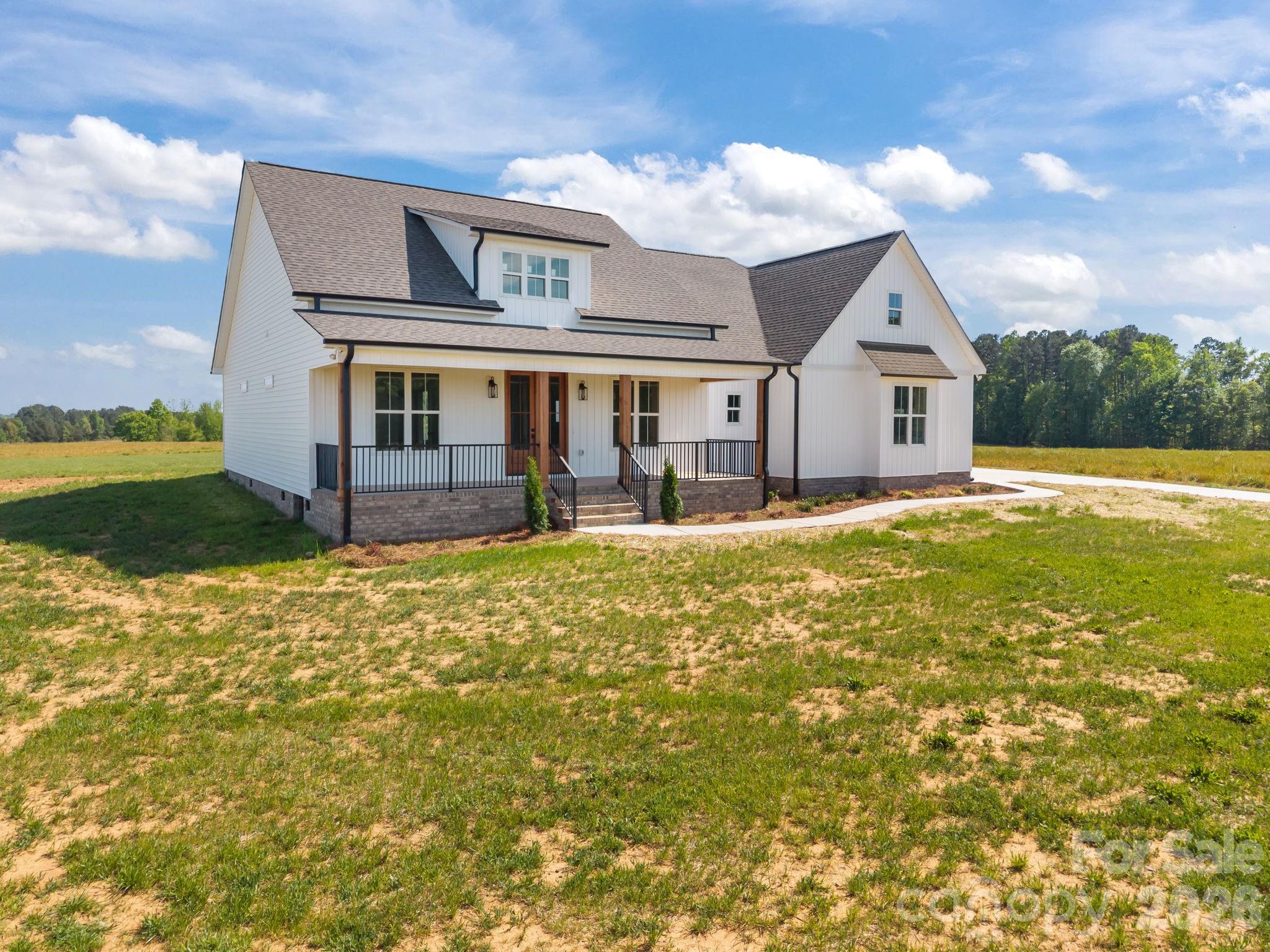 4805 Patterson Road China Grove, NC 28023 - Photo 2 of 42 a front view of a house with a yard