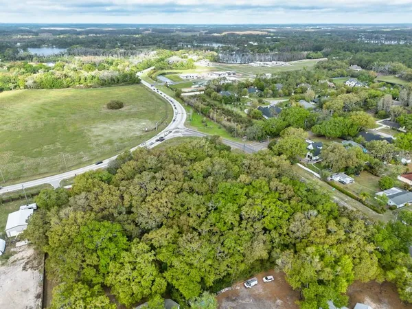 a view of a field with an ocean view