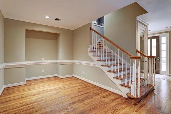 a view of entryway with wooden floor