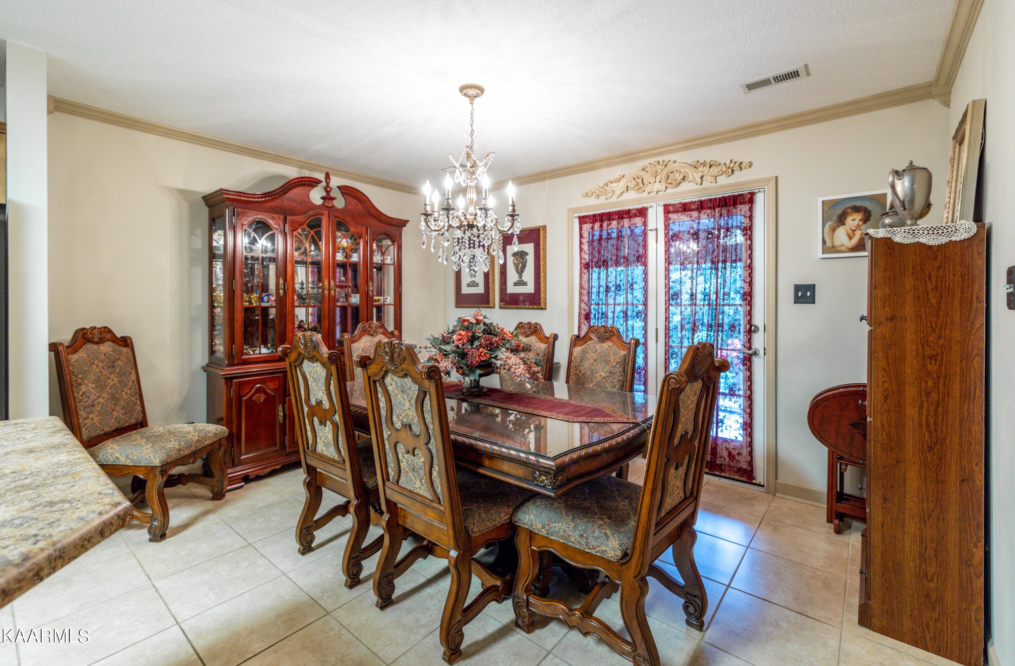 9043 Rocky Ridge Way, Unit 9 Knoxville, TN 37924 - Photo 14 of 31 a view of a dining room with furniture and chandelier