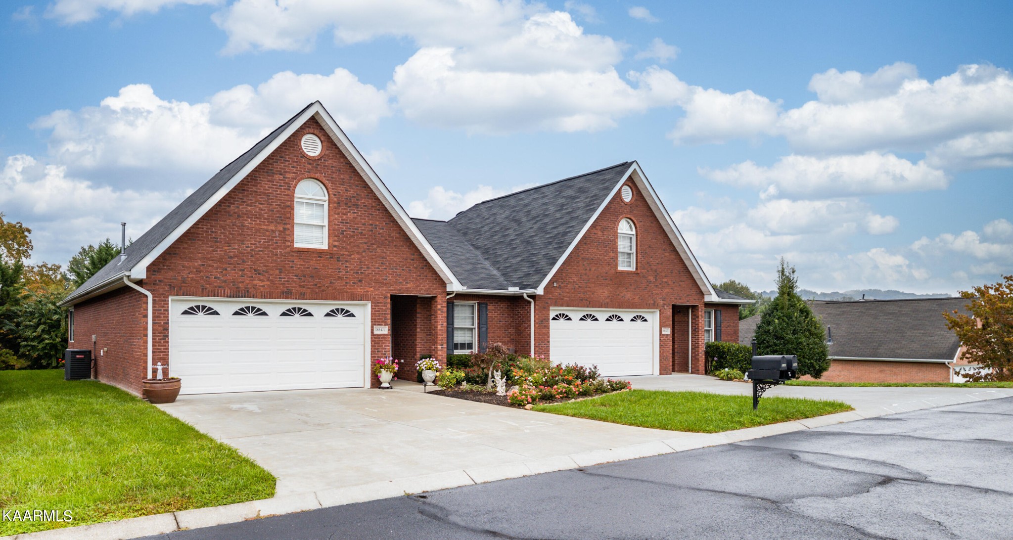 9043 Rocky Ridge Way, Unit 9 Knoxville, TN 37924 - Photo 30 of 31 a front view of a house with a yard and garage
