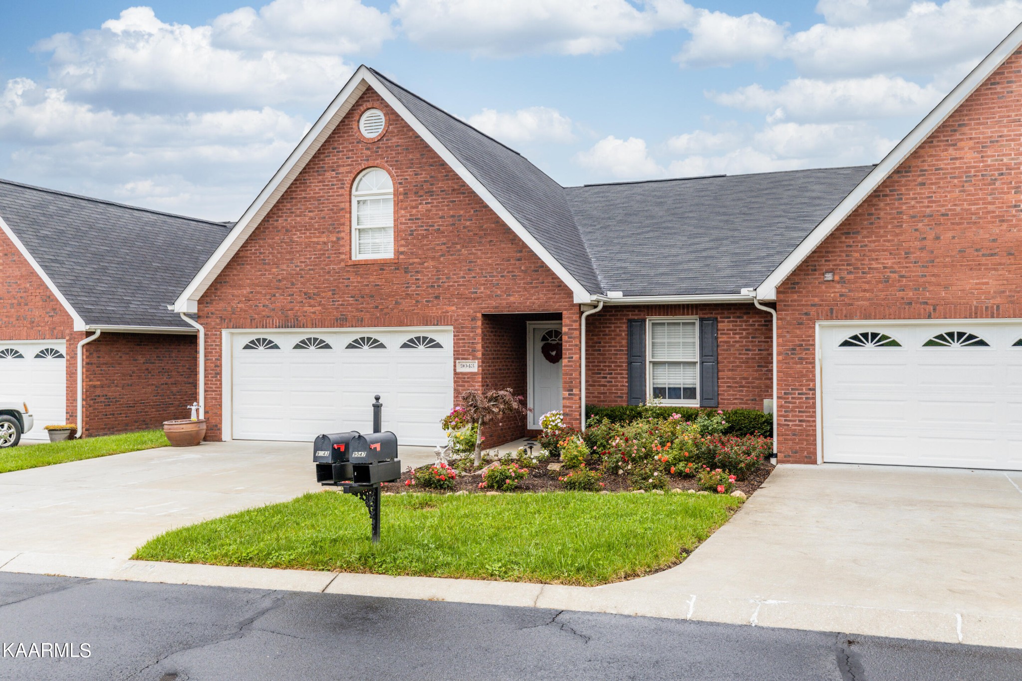 9043 Rocky Ridge Way, Unit 9 Knoxville, TN 37924 - Photo 31 of 31 a front view of a house with garden