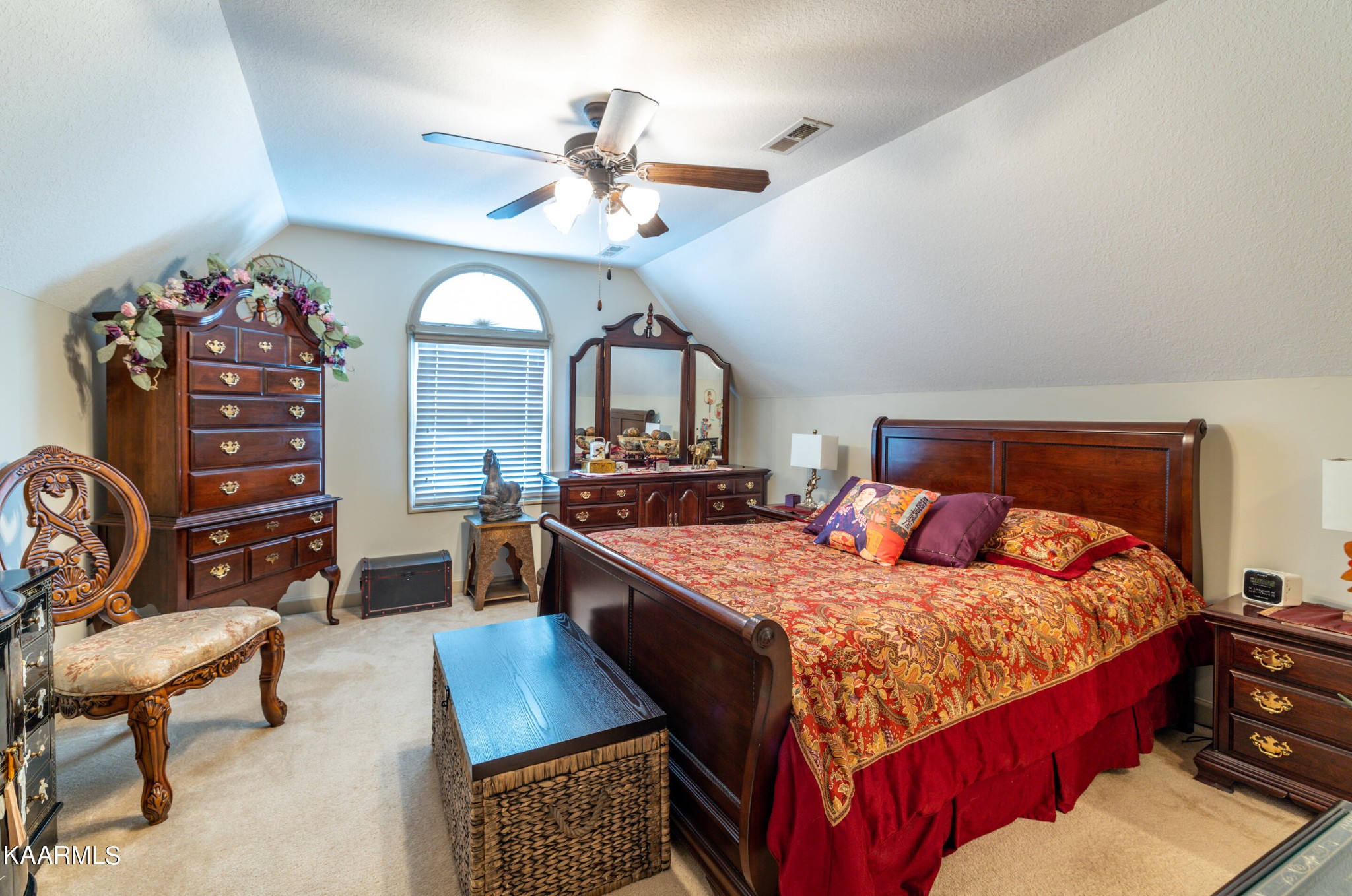 9043 Rocky Ridge Way, Unit 9 Knoxville, TN 37924 - Photo 8 of 31 a bedroom with a bed a dresser and chair