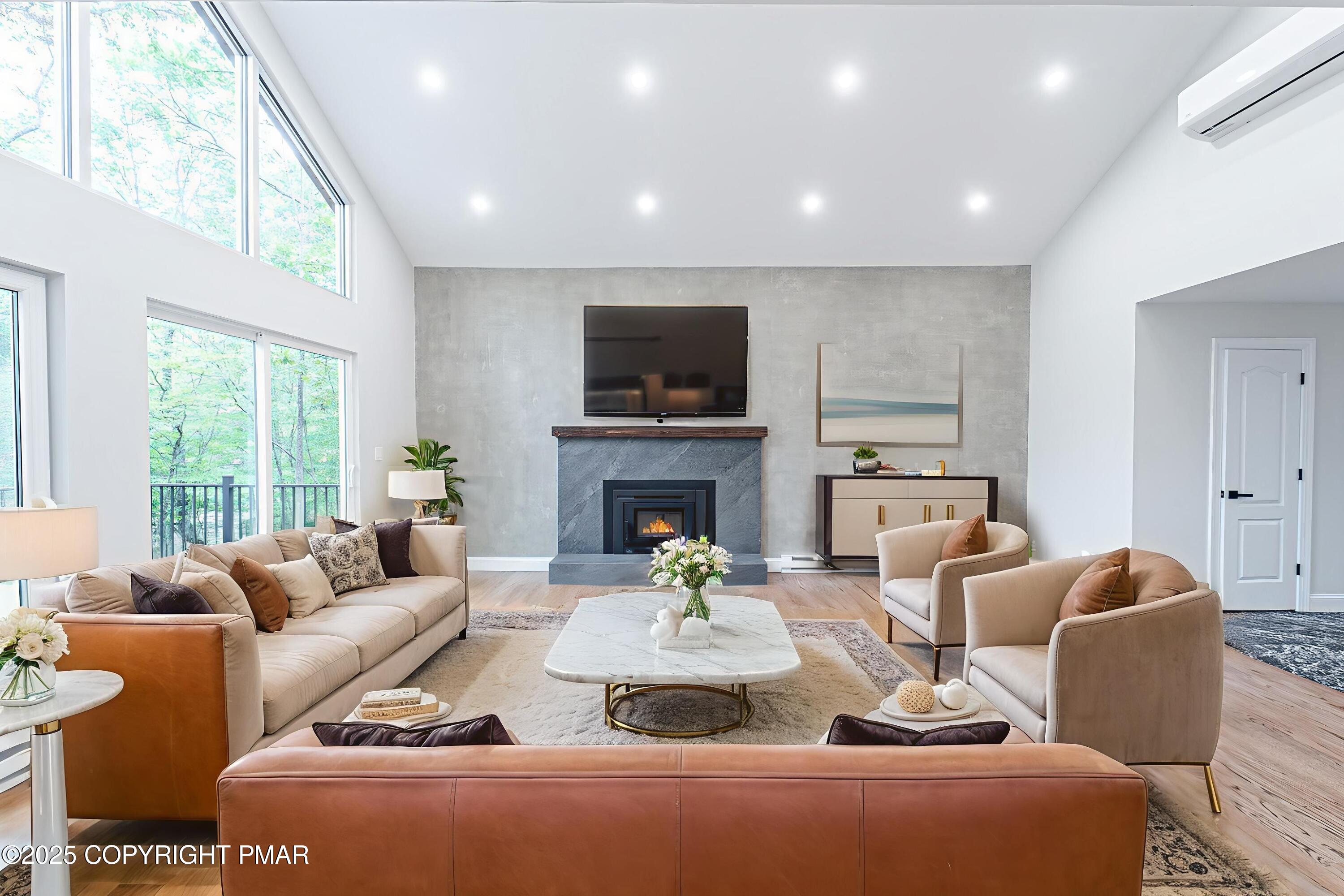 5806 Decker Road Bushkill, PA 18324 - Photo 12 of 76 a living room with furniture fireplace and a large window